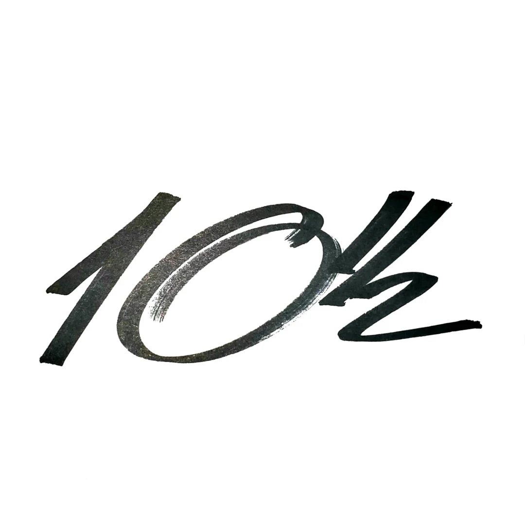Stylized handwritten logo '10½', representing a unique signature for bespoke culinary experiences | B&Co